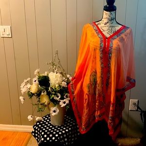 An India-made blouse. Buttons down front and back.
